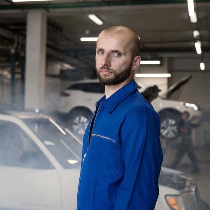 Ray Brenner in coveralls in the ABC Auto workshop.